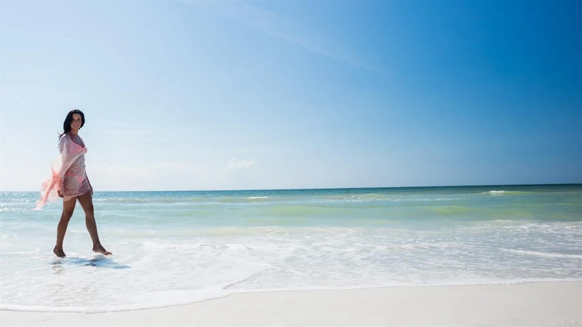 Woman Walking on the Beach