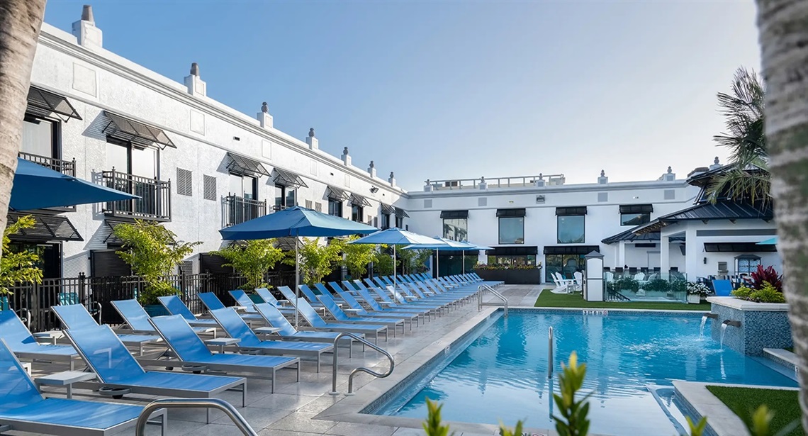 Pool and chairs at inn on fifth