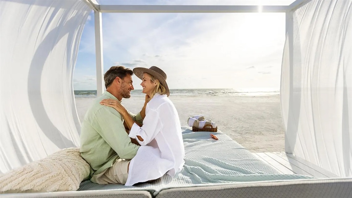 Couple in Beach Cabana at JW Marriott Marco Island Beach Resort