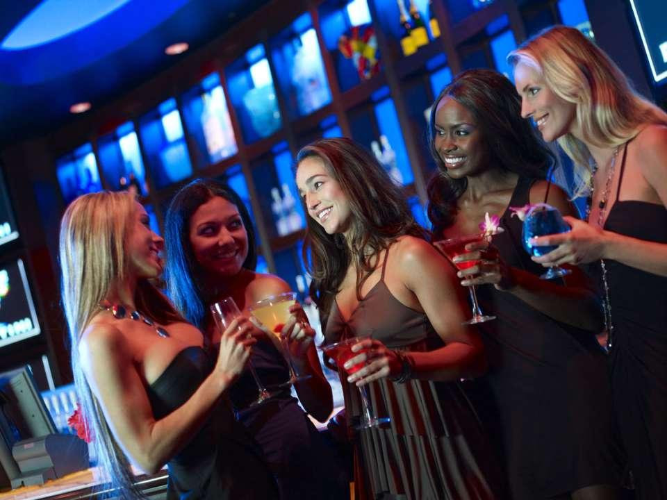 Women Enjoying Drinks at Blue Martini