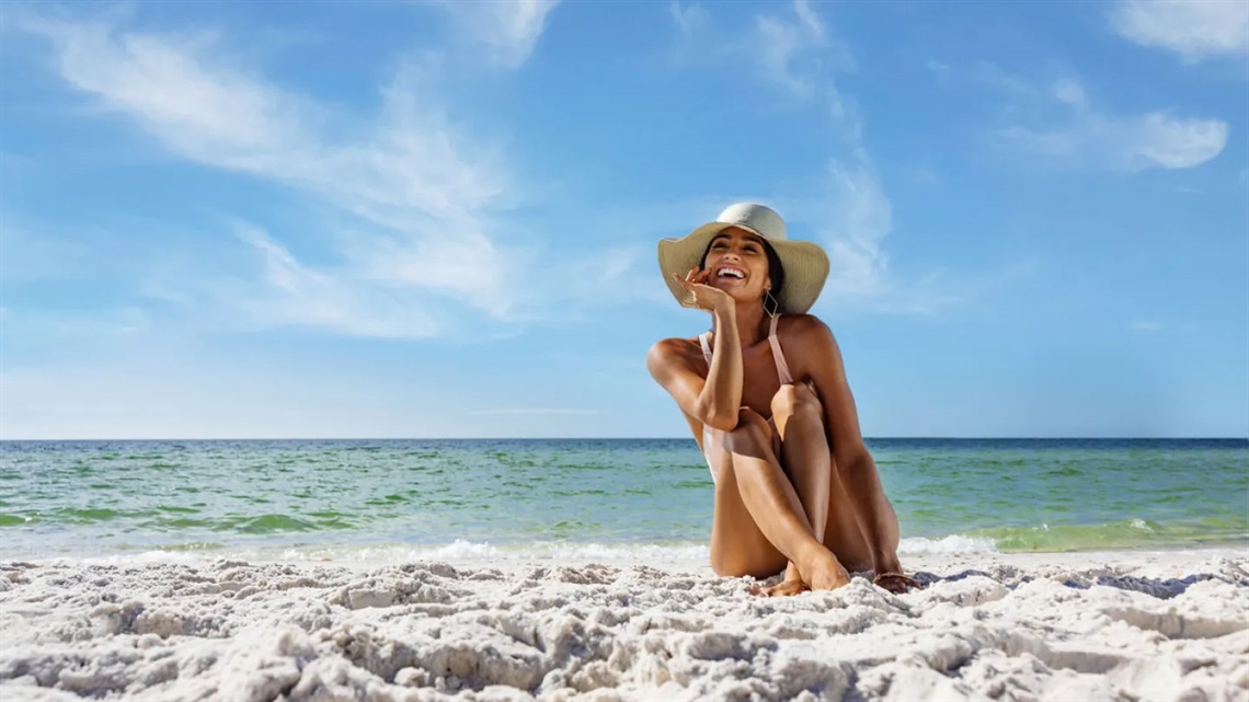 Woman Sitting on the Beach