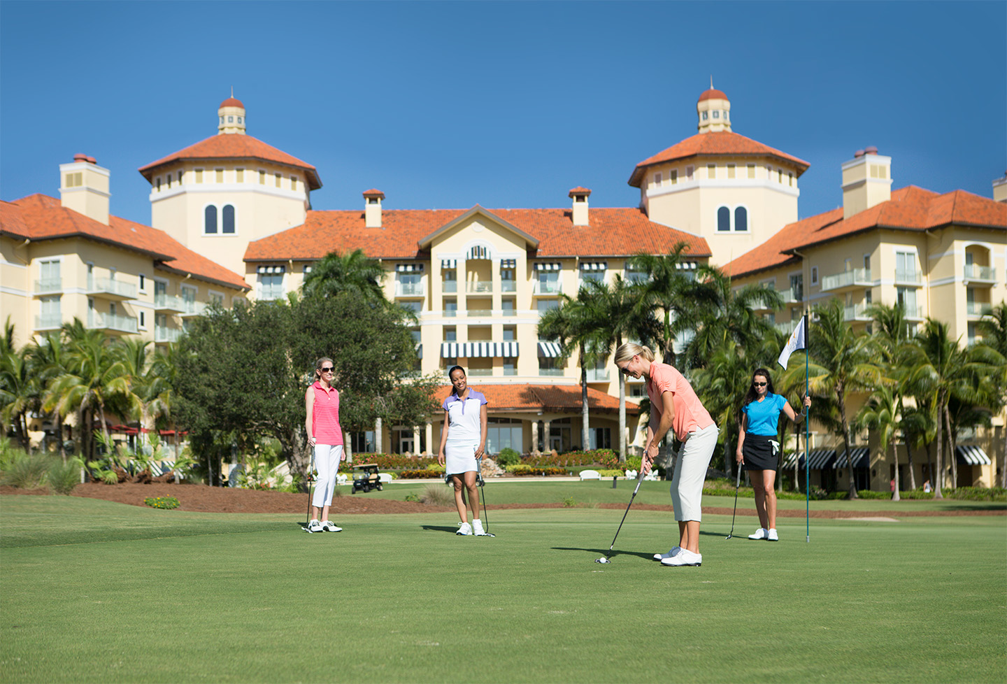 Golf Course Women Putting Ritz Carlton.jpg
