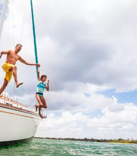 things-to-do-hero-family-jumping-off-sailboat.jpg