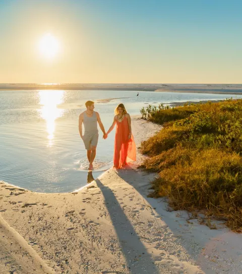 Couple walking on Tigertail Beach