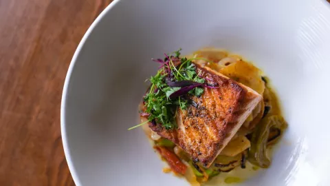 A view from above of a plated meal of grilled seaf