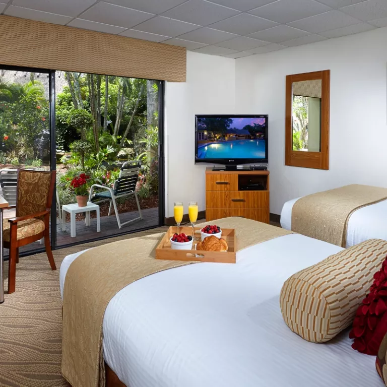 Standard Room with patio to our lush tropical landscape and Koi fish ponds. Photo 5