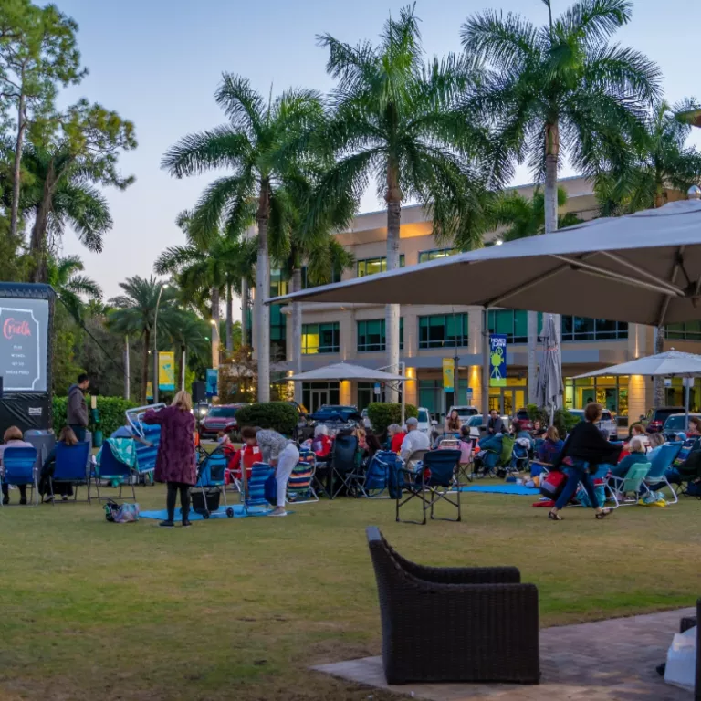 a group of people enjoying an outdoor movie screening Photo