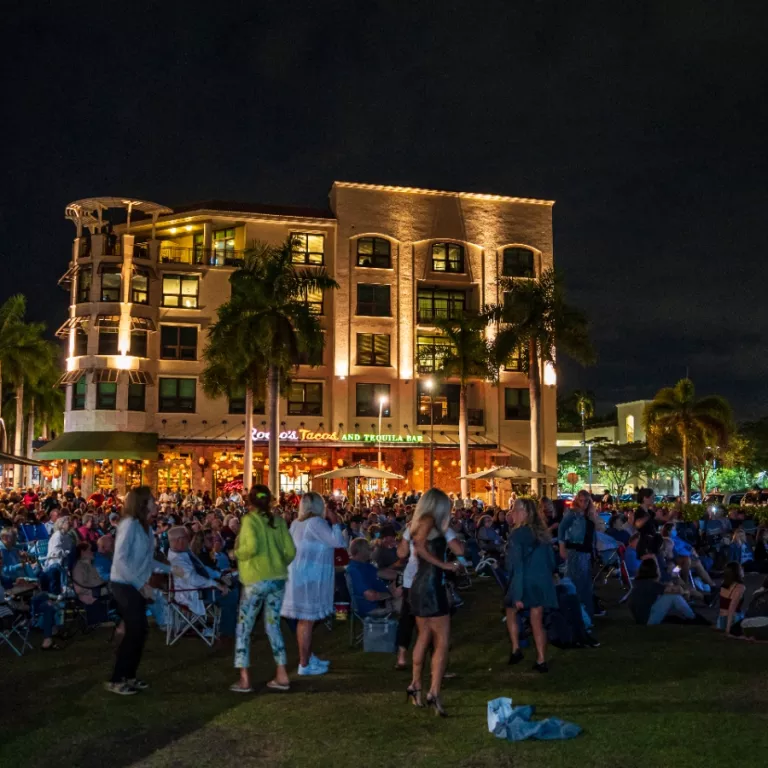 a group of guests dancing at a Mercato Nights Music Series concert Photo