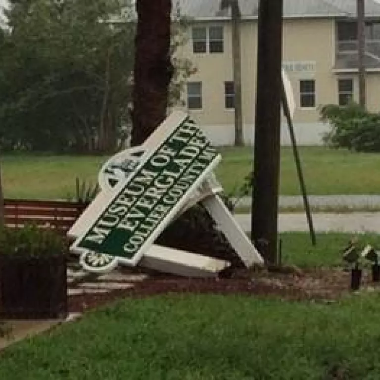 hurricane damaged sign for the Museum of the Everglades Photo