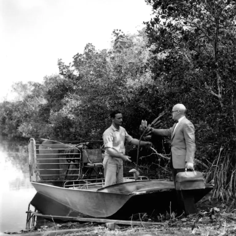 Black and white. Two men on a boat in the Everglades Photo