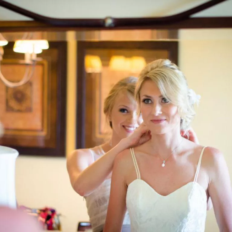 Bride looking in mirror at JW Marriott, Marco Island Photo 2
