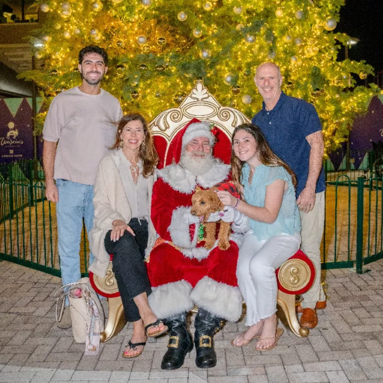Family posing with Santa at Santa Paws 2023 Photo