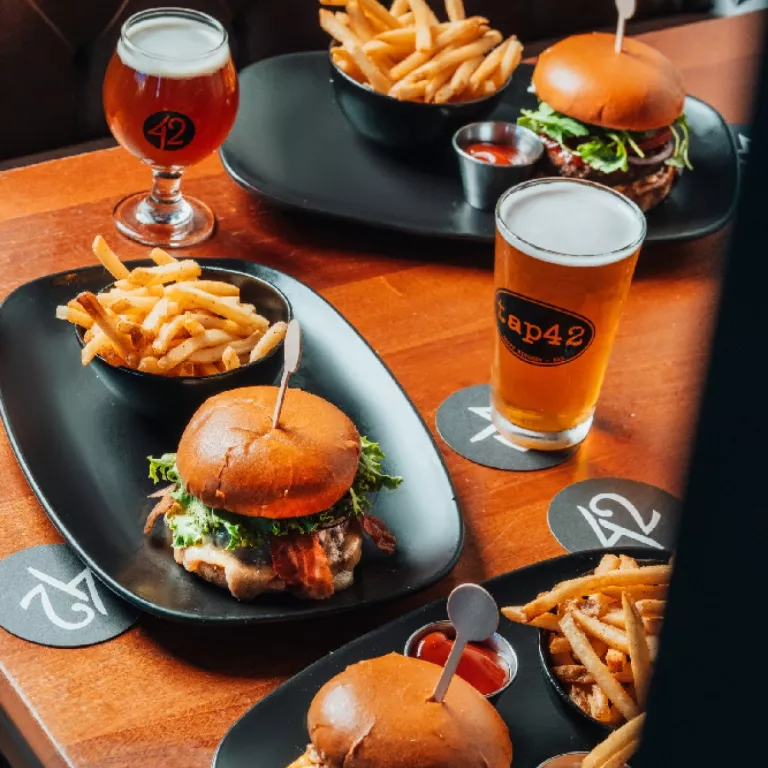 Tap 42 burgers and sandwiches served with crispy fries and ice cold beverages Photo