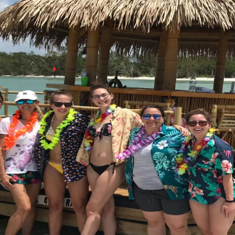 tiki cruise with ladies enjoying a beach stop Photo 3