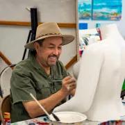 Man painting a bust