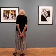 A woman views art in an art gallery.