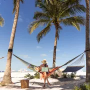 Woman at beach with laptop