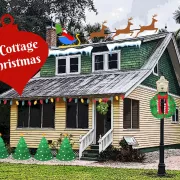 Yellow cottage with clip art Christmas decorations Photo