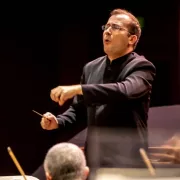 Image of Radu Radu Paponiu, conductor of the Naples Philharmonic on stage during a performance Photo