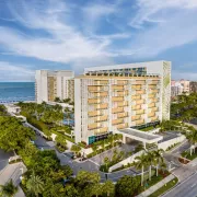 High-rise building on the beach showing entry and surrounding area. Photo