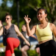 female working out during outdoor fitness class Photo