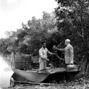Black and white. Two men on a boat in the Everglades Photo