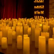illuminating candles displayed on a stage at a candlelight concert Photo