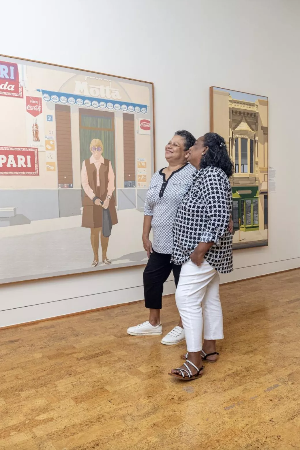 A lesbian couple admires art at the Baker Museum.