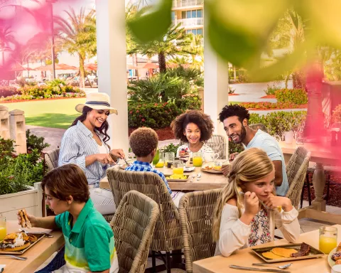 Family dining outside on a patio.