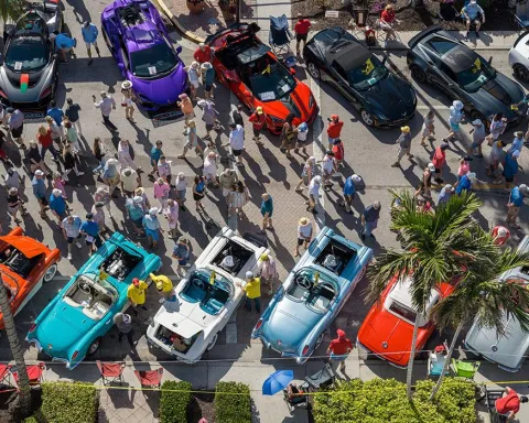 aerial of crowd viewing vintage cars on fifth street