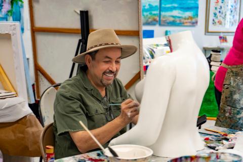 Man painting a bust