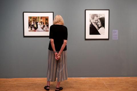 A woman views art in an art gallery.