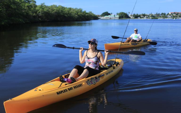 Couple heading out to fish in kayaks