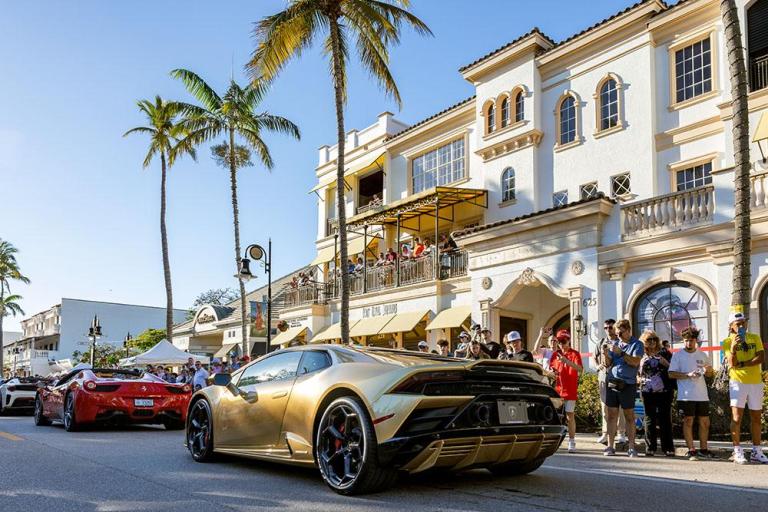 crowd admires lamborghini on fifth avenue